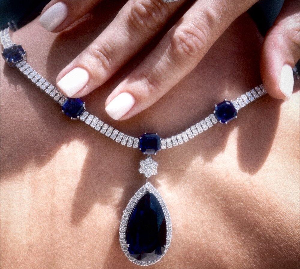 Sapphire and diamond necklace with pear-cut pendant and matching ring